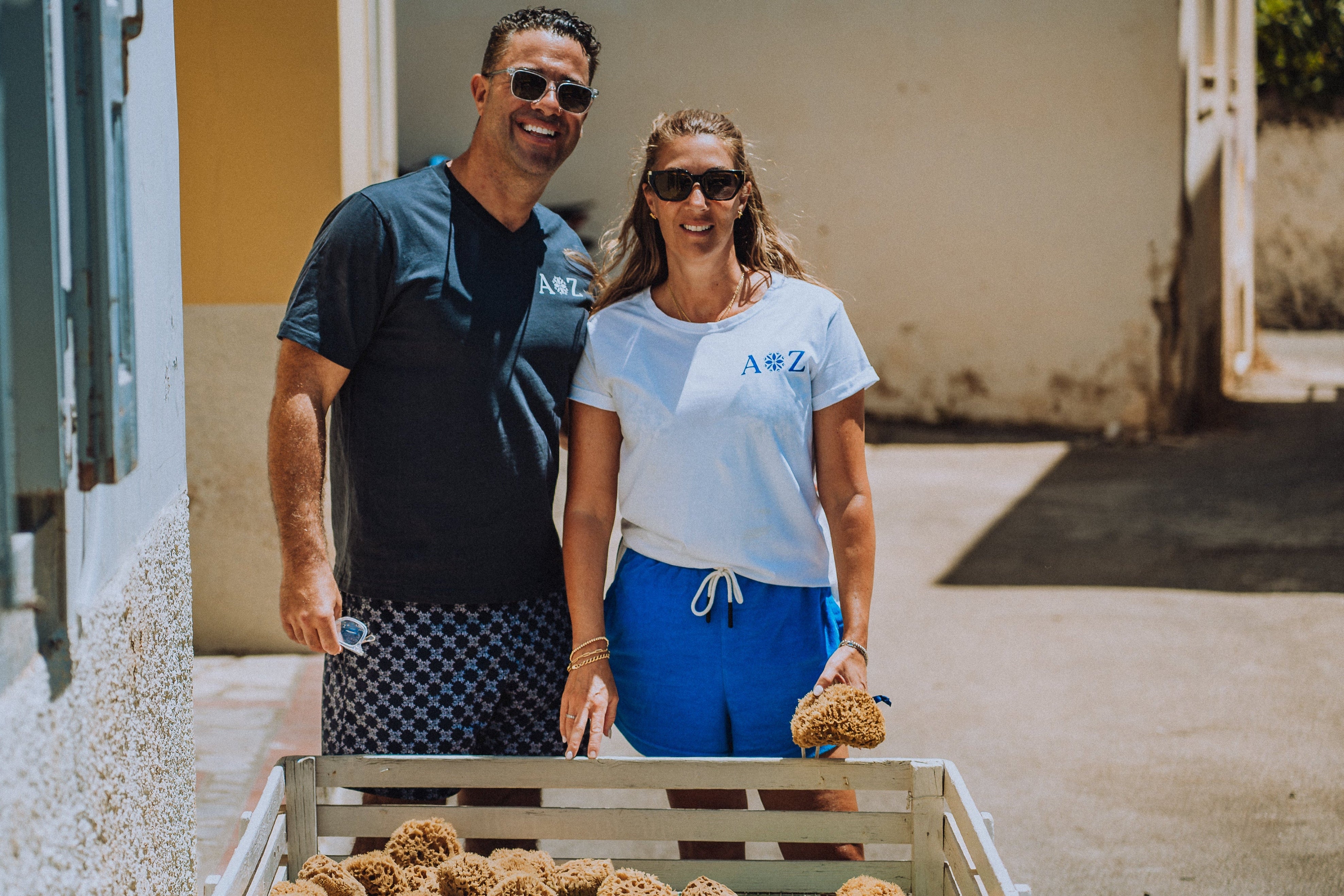Melissa and Mark founders of aqua zoi in greece with sea sponges