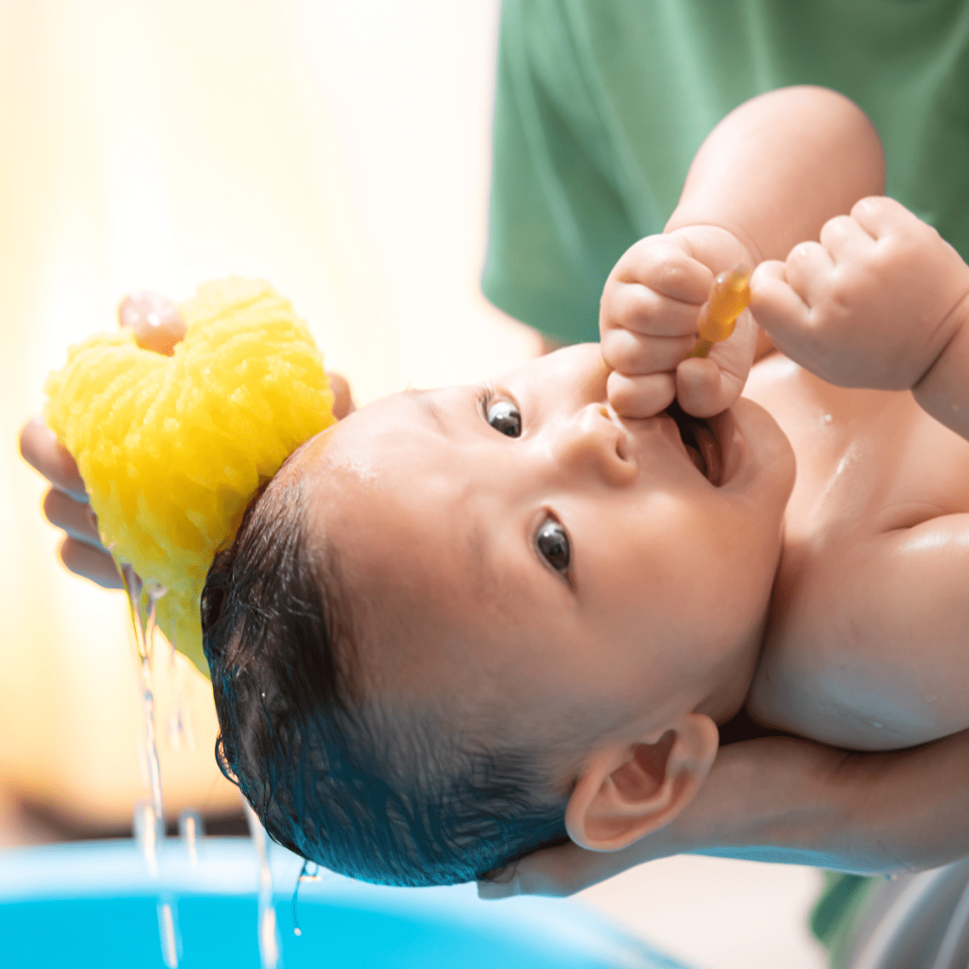 washing a baby with natural sea sponge