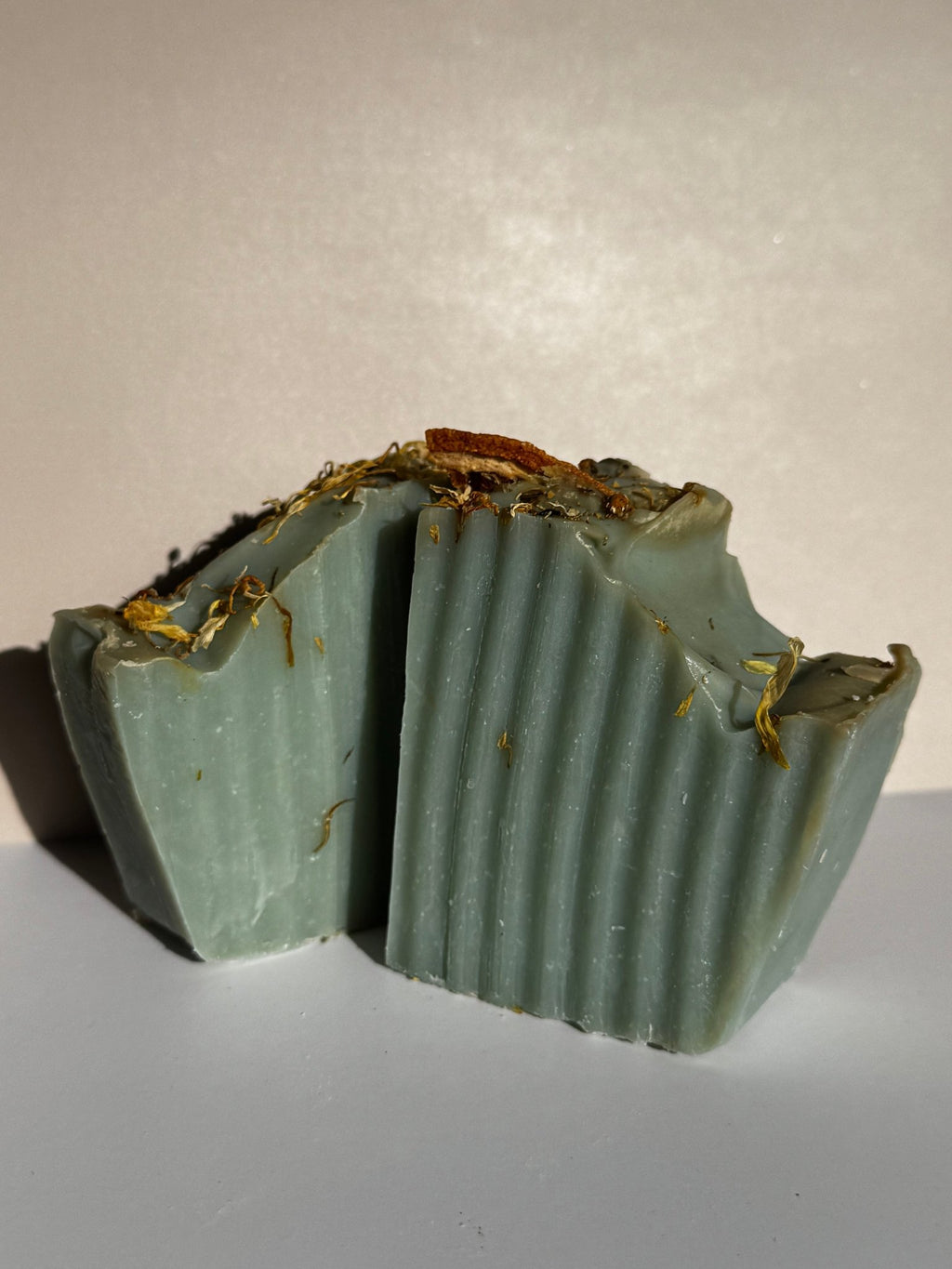 Sage and orange handmade olive oil soap bars with botanical decoration
