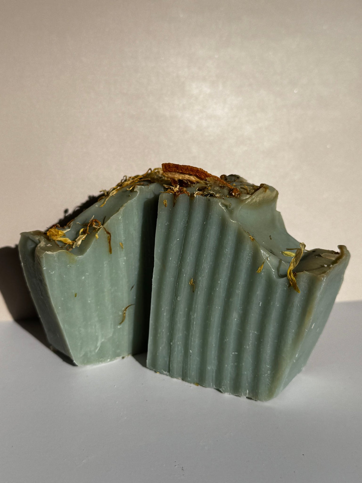 Sage and orange handmade olive oil soap bars with botanical decoration