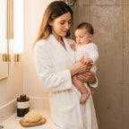 mother and baby in bathromm with natural sea sponge